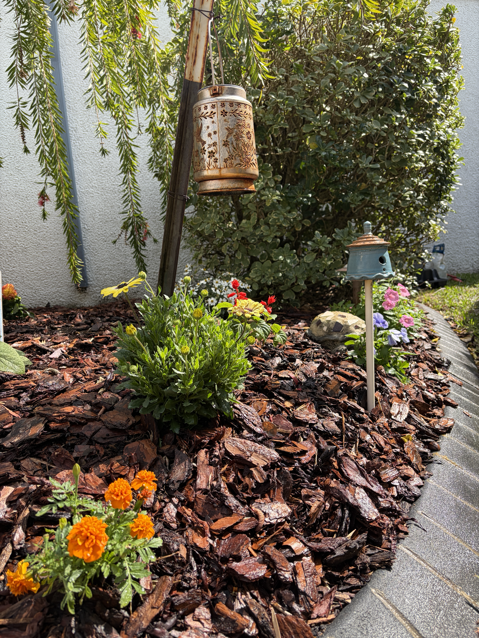 Mulched flower bed detail with landscape lighting